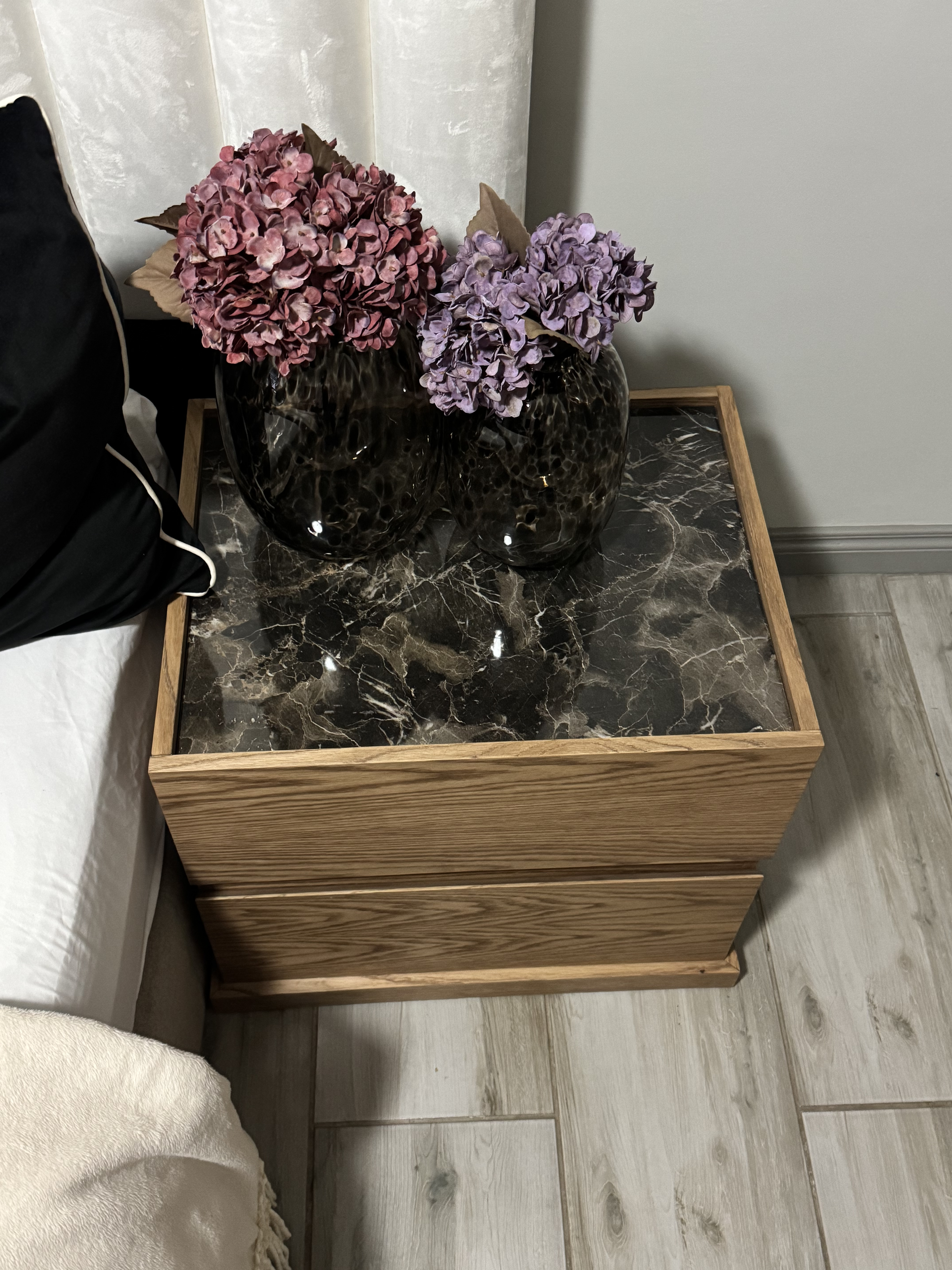 Custom floating TV unit on brick wall