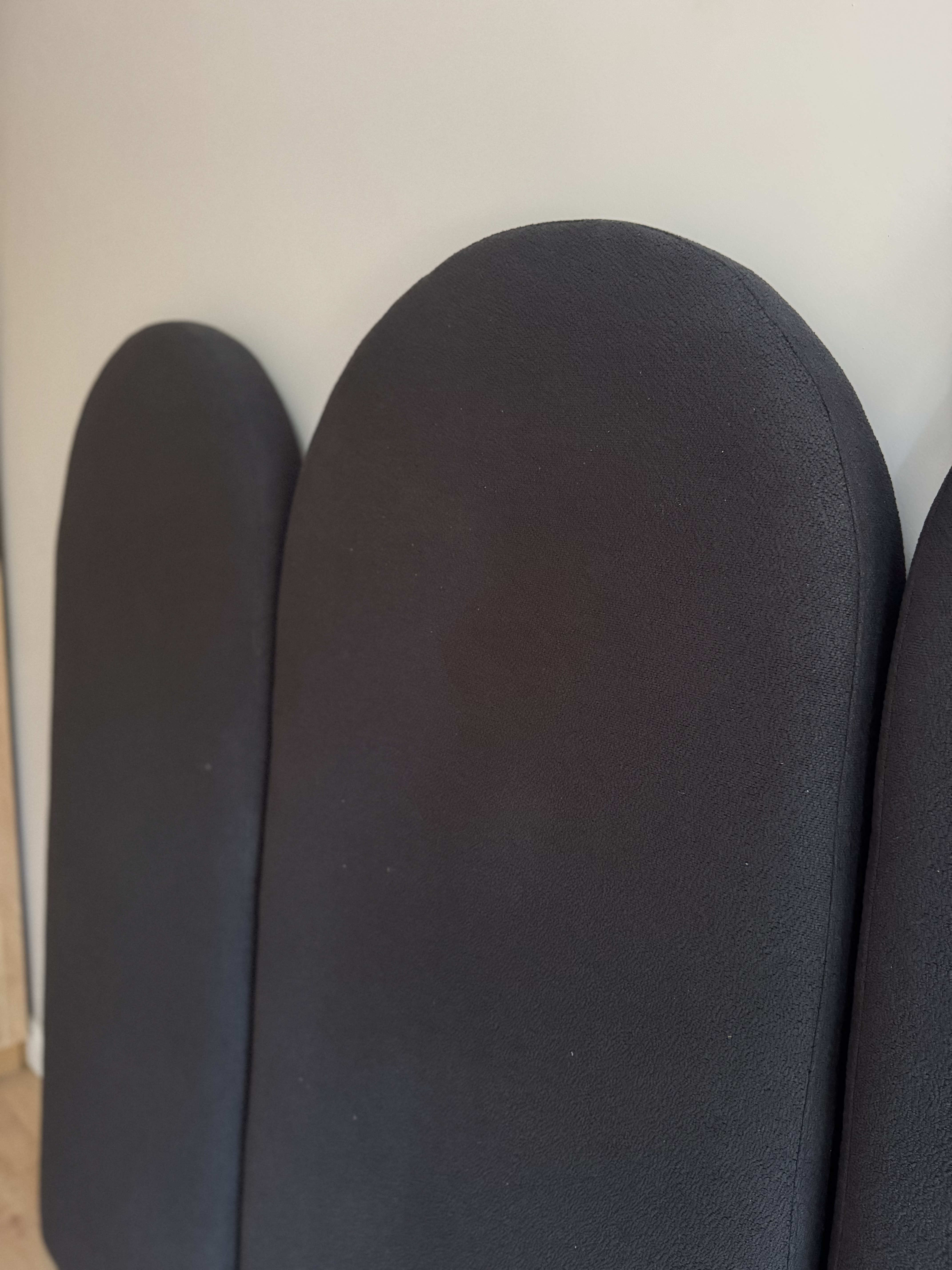 Curved lounge set with patterned poufs